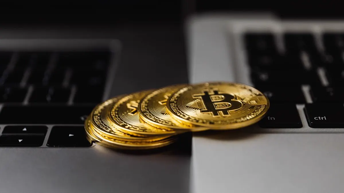Bitcoin coins on a laptop keyboard