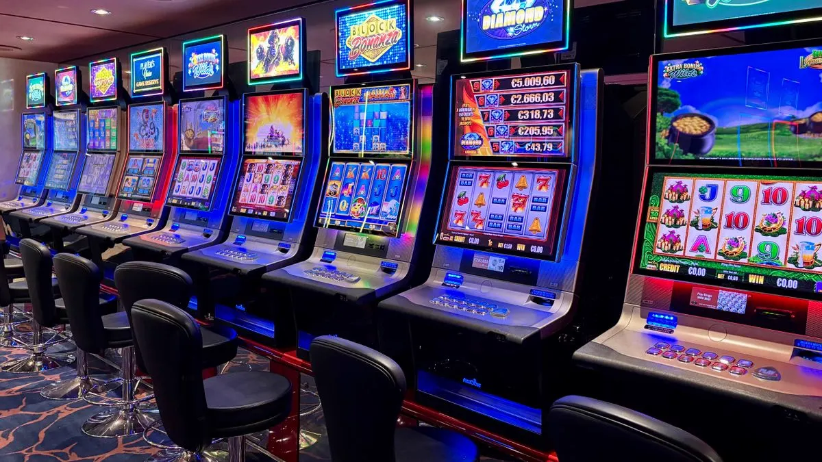 A row of brightly lit gaming machines